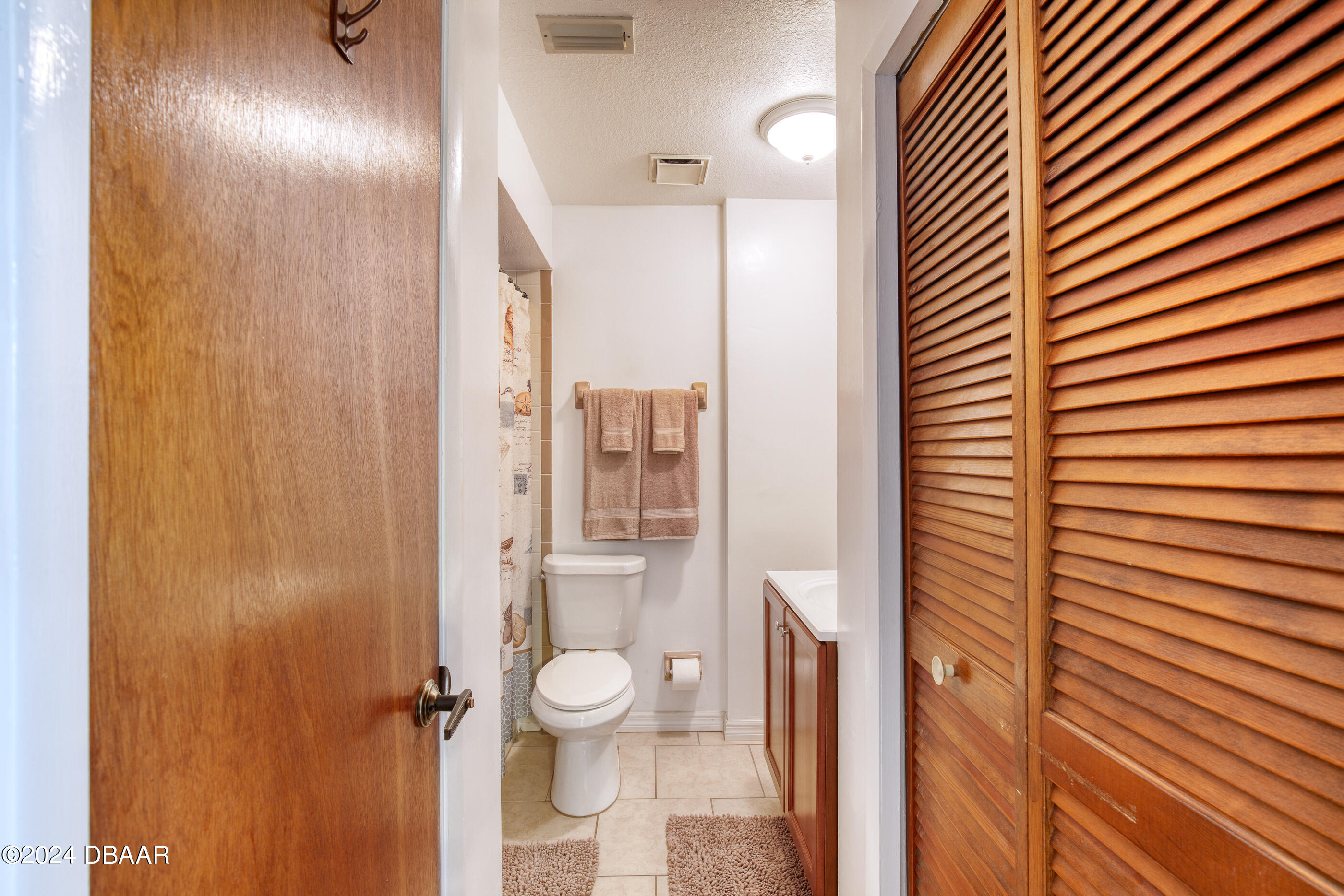 2304 Yule Tree Drive Edgewater, FL 32141 - Photo 23 of 34 a bathroom with a toilet and a shower