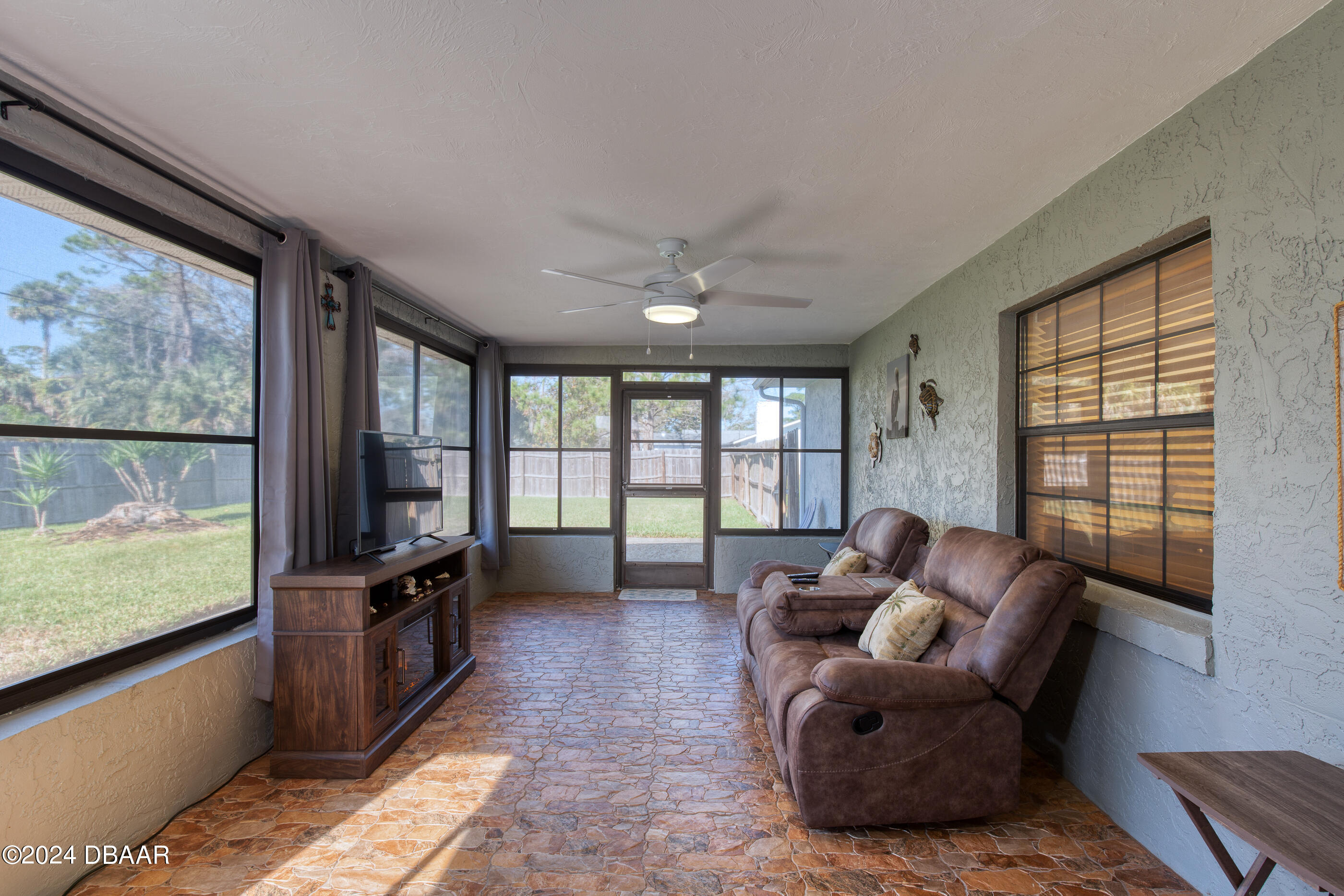 2304 Yule Tree Drive Edgewater, FL 32141 - Photo 25 of 34 a living room with furniture and a flat screen tv