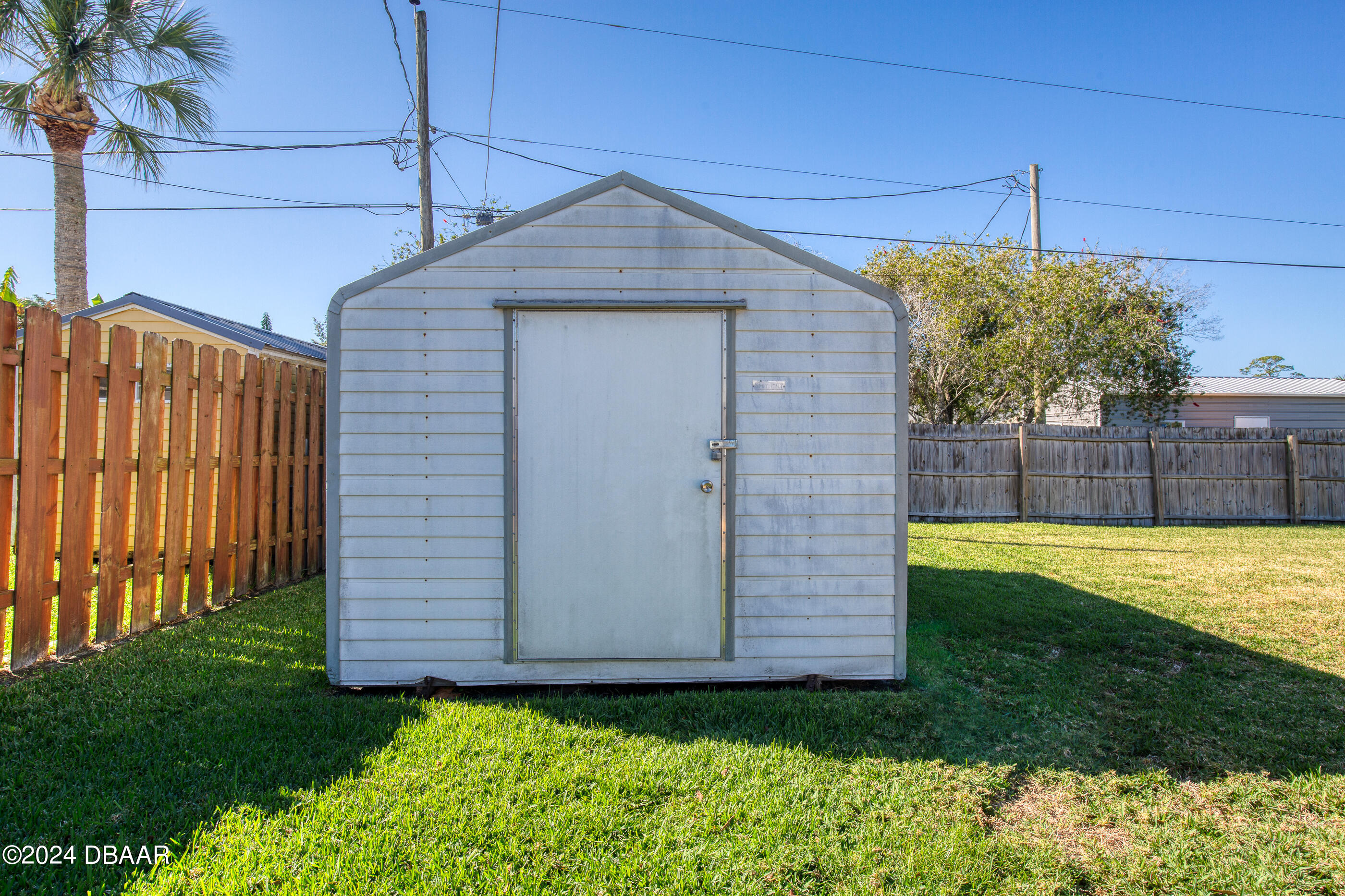 2304 Yule Tree Drive Edgewater, FL 32141 - Photo 30 of 34 a front view of a house with a yard