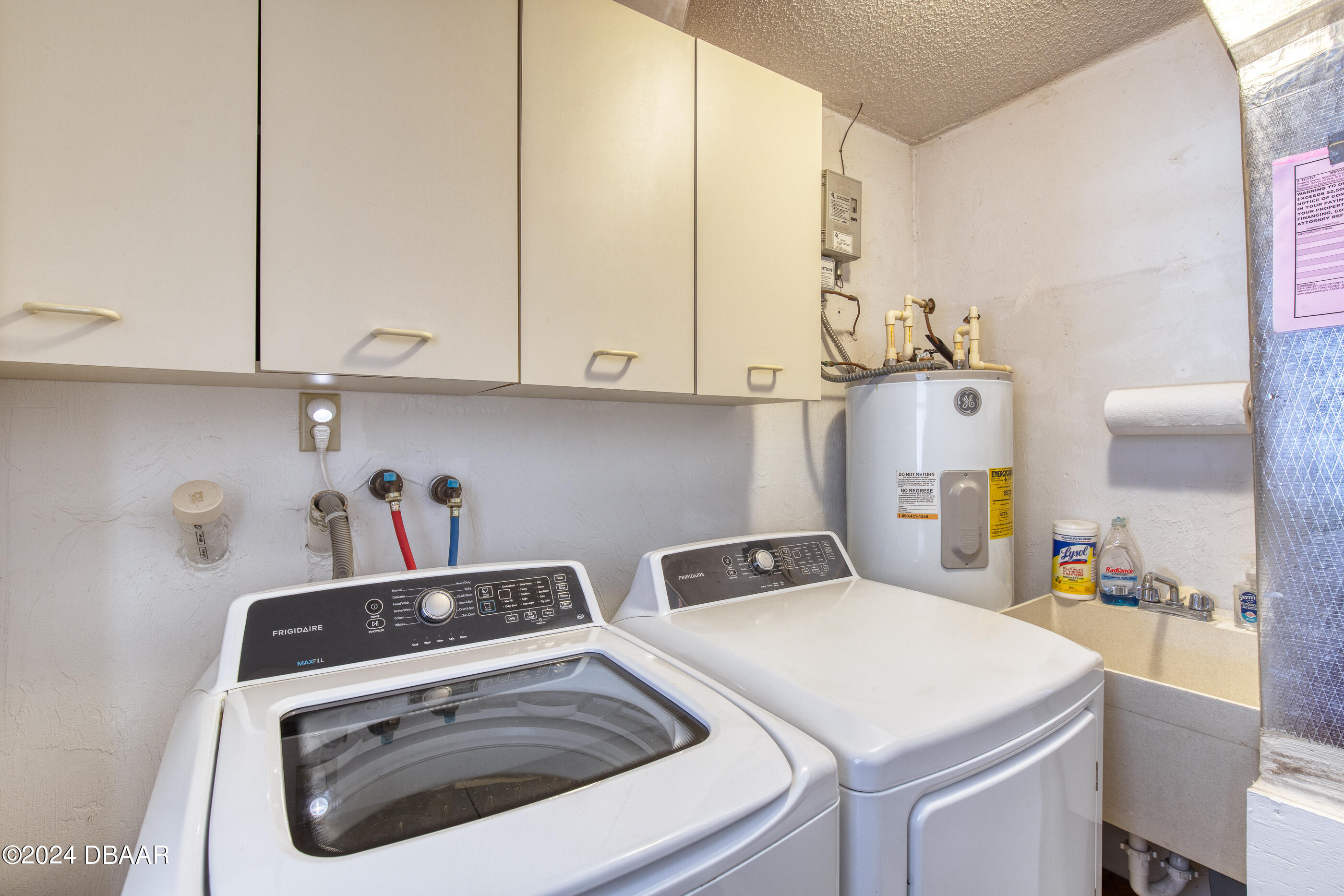 2304 Yule Tree Drive Edgewater, FL 32141 - Photo 32 of 34 a utility room with dryer and washer