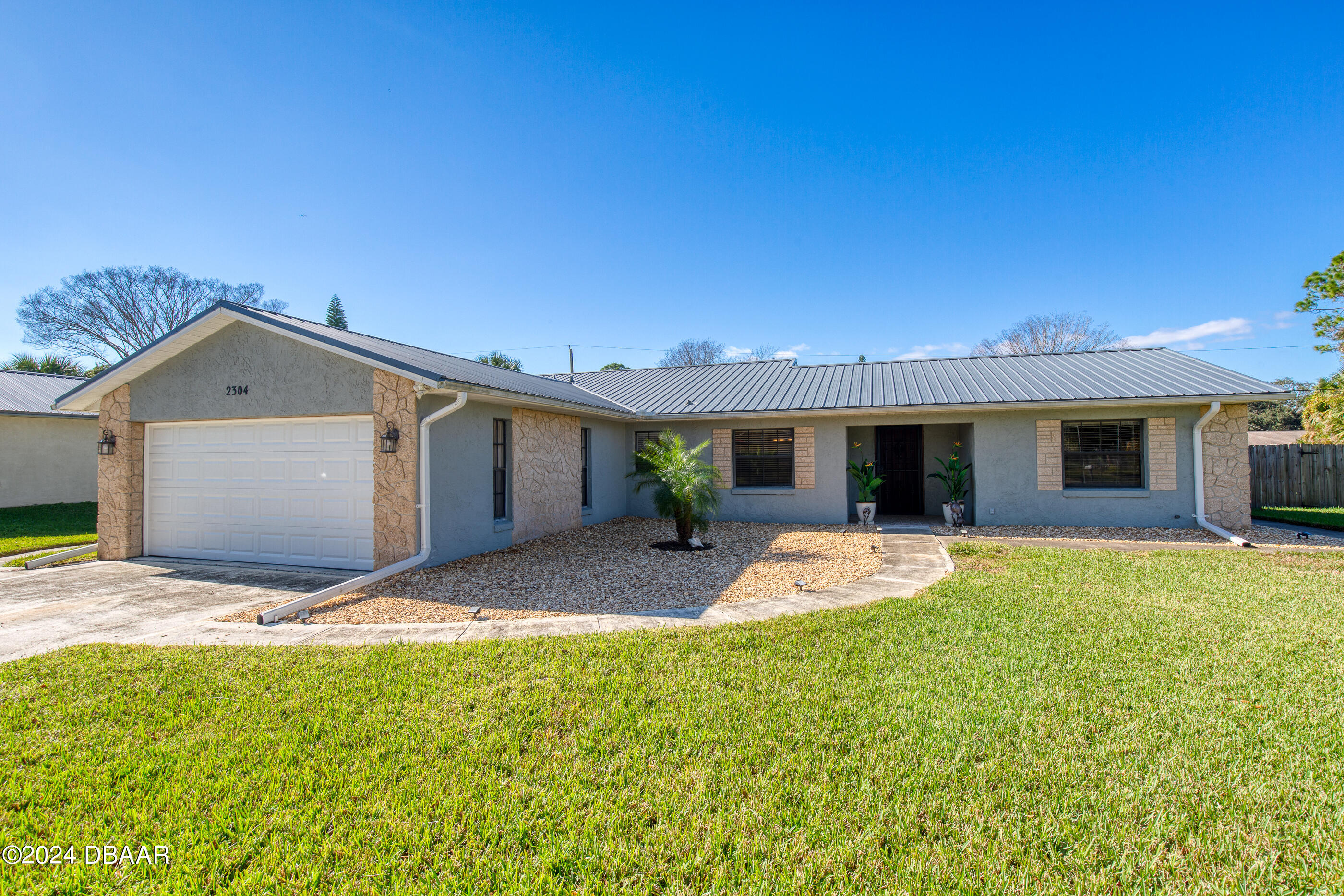2304 Yule Tree Drive Edgewater, FL 32141 - Photo 6 of 34 a house view with a garden space