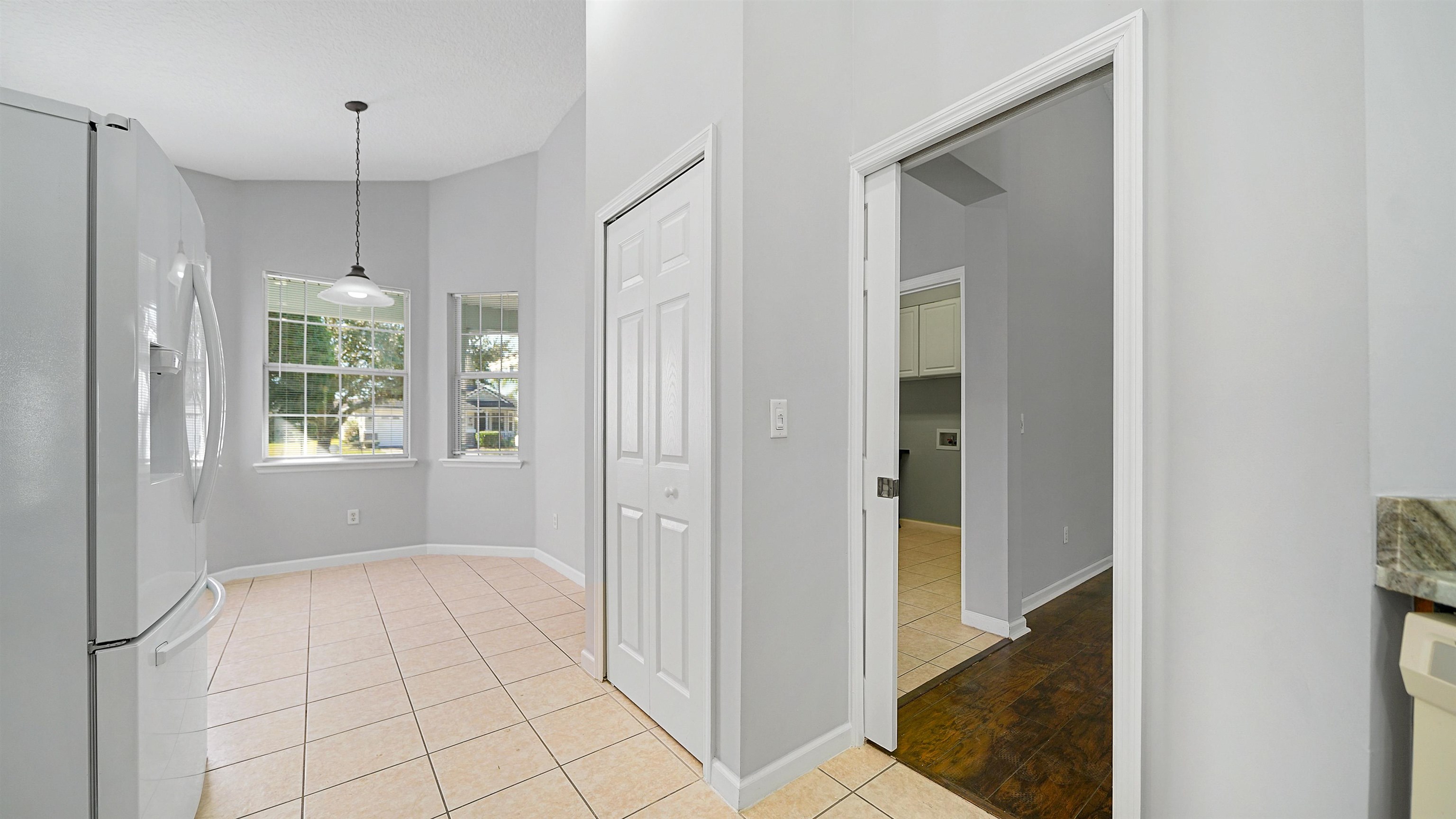 778 Copperhead Circle St. Augustine, FL 32092 - Photo 11 of 35 a view of an empty room with window and chandelier fan