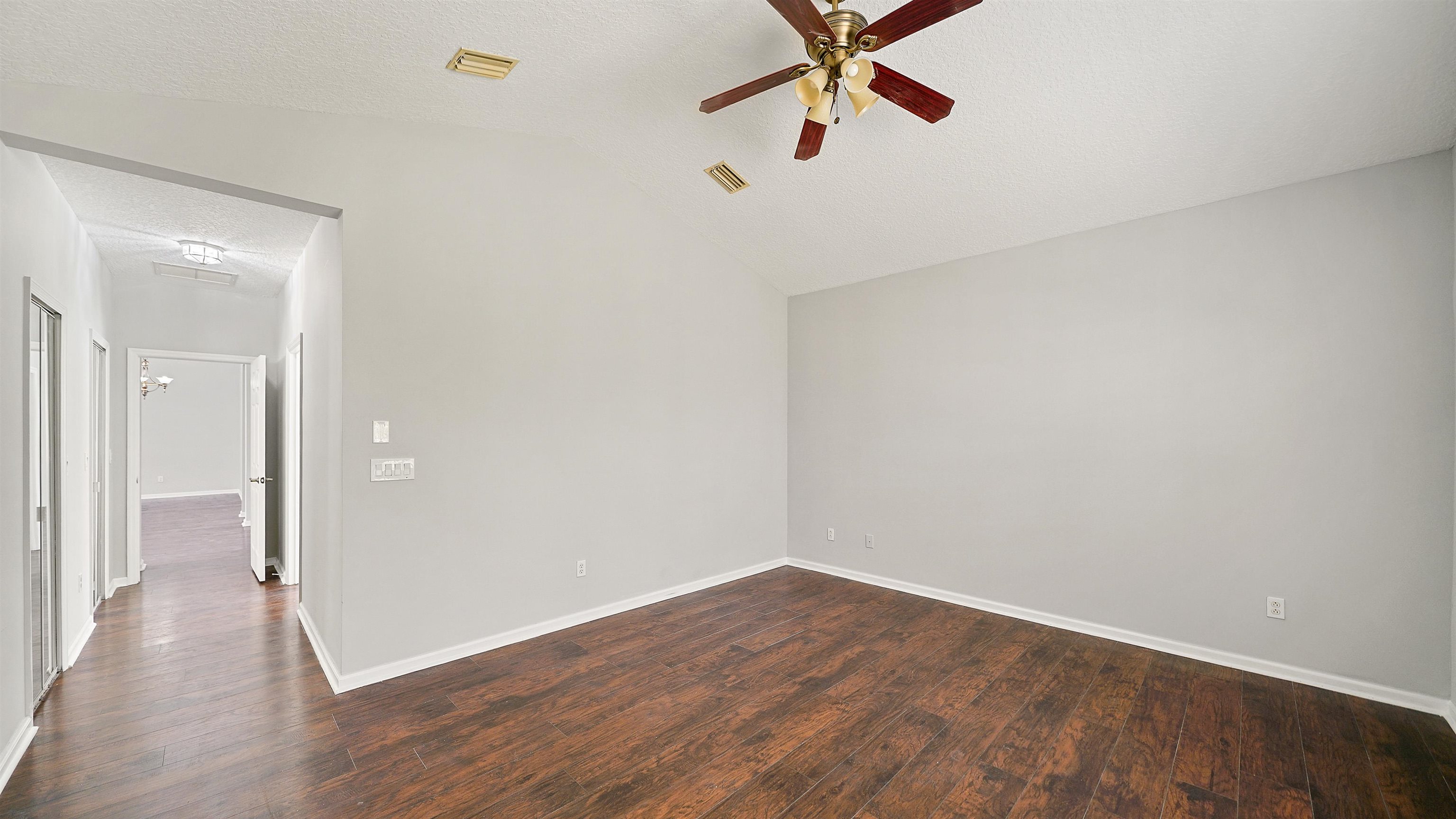 778 Copperhead Circle St. Augustine, FL 32092 - Photo 12 of 35 wooden floor in an empty room with a window