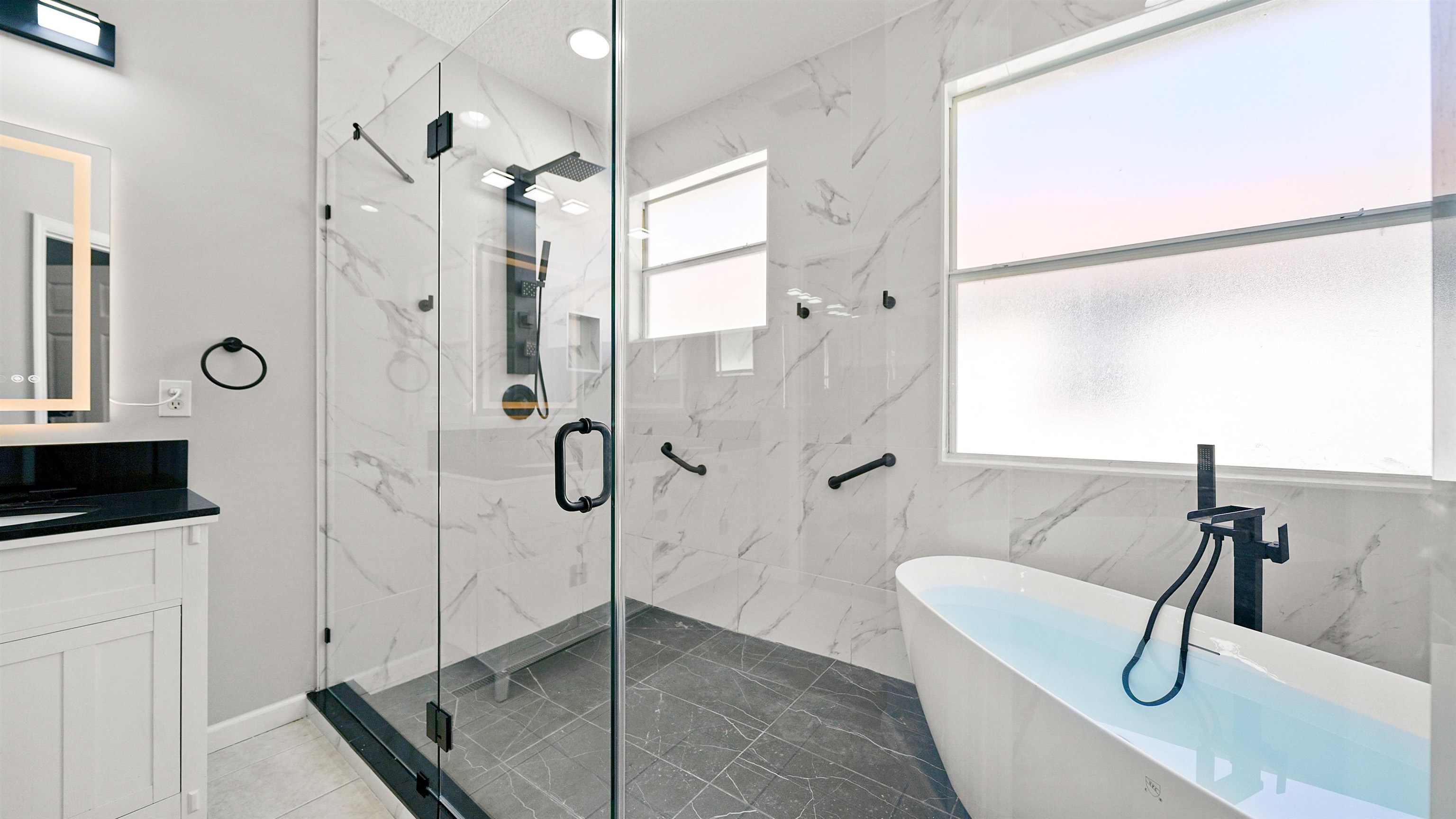 778 Copperhead Circle St. Augustine, FL 32092 - Photo 15 of 35 a bathroom with a tub and a shower
