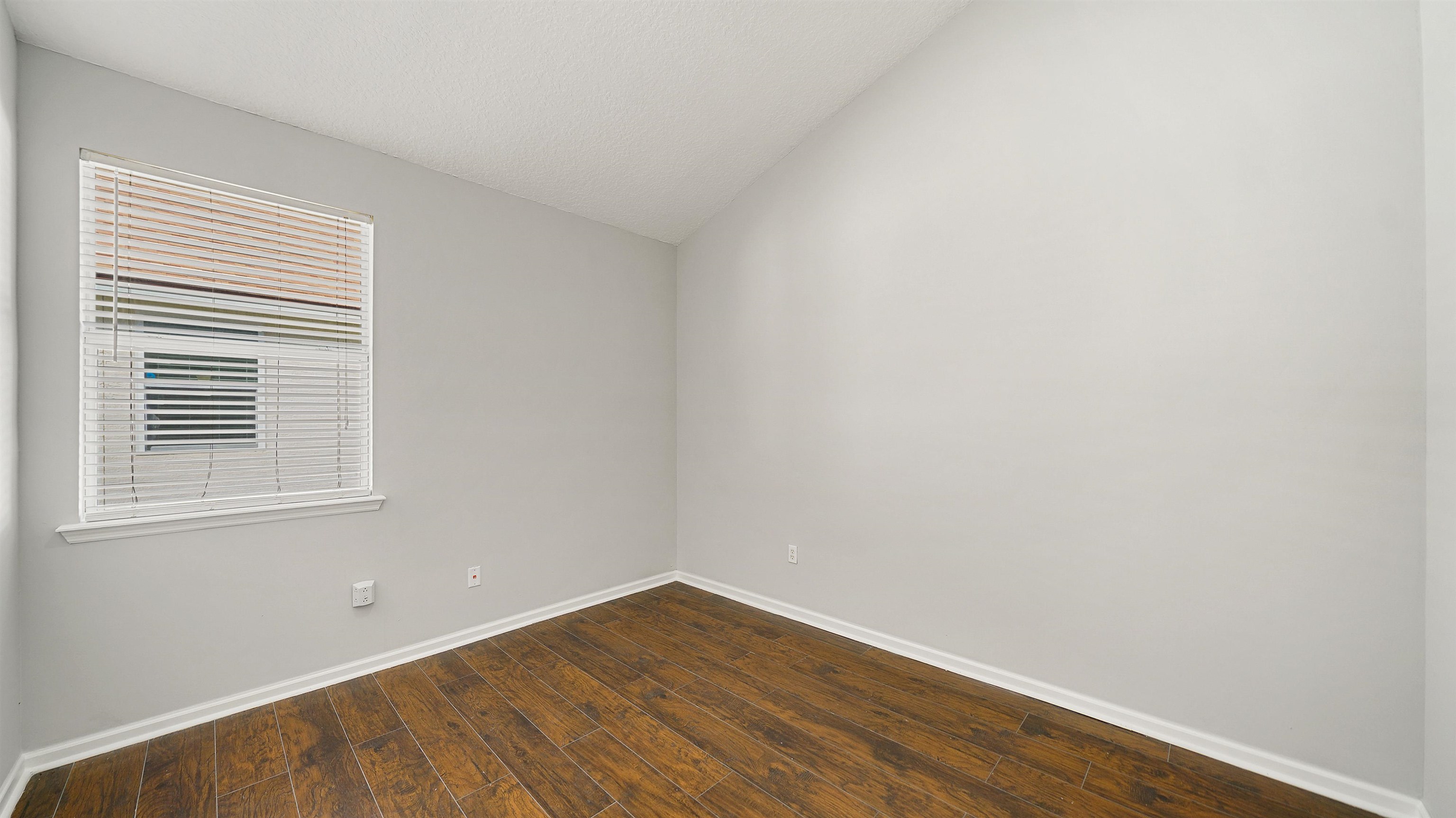 778 Copperhead Circle St. Augustine, FL 32092 - Photo 20 of 35 a view of an empty room with wooden floor and a window