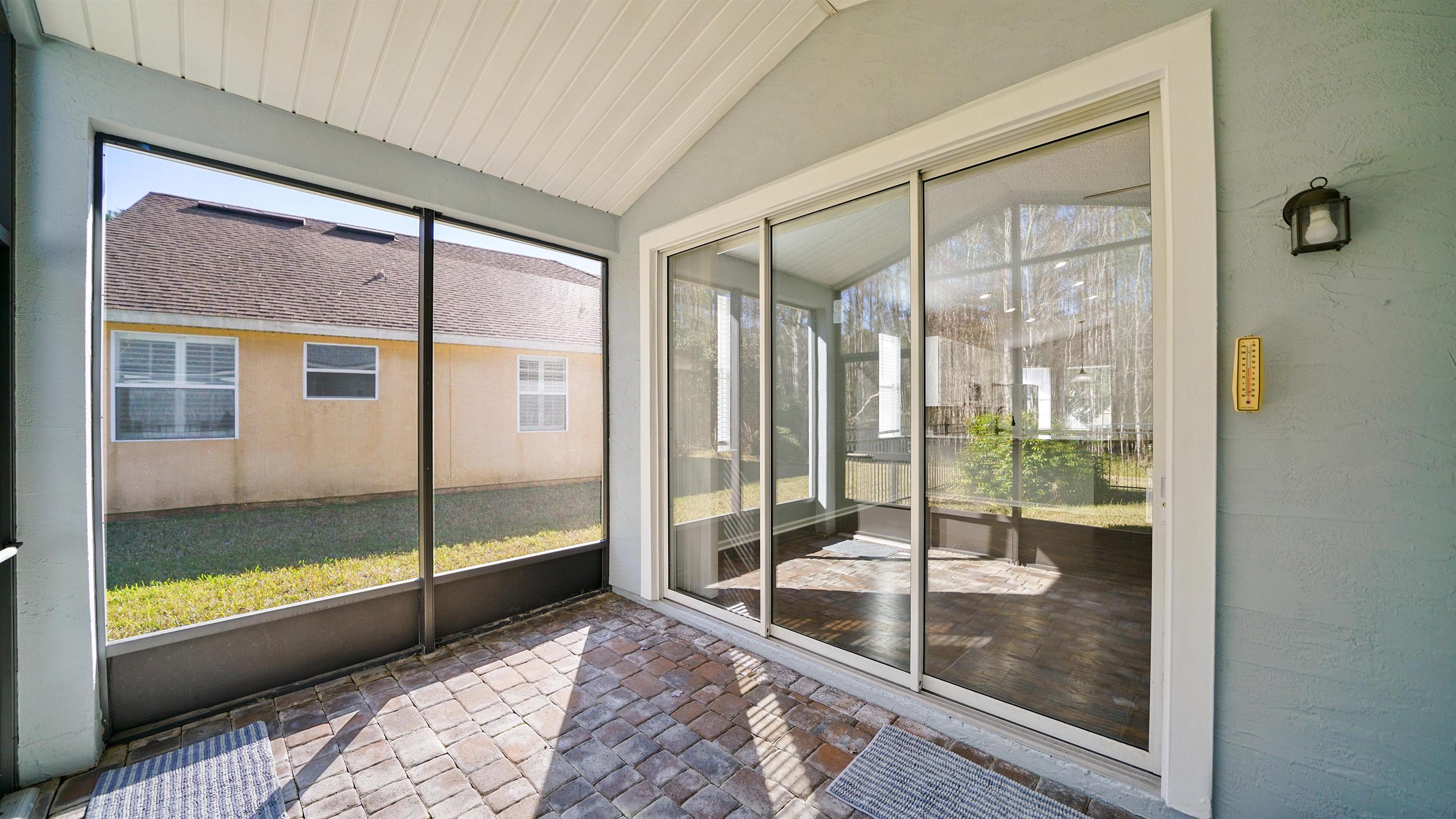 778 Copperhead Circle St. Augustine, FL 32092 - Photo 23 of 35 a bathroom with a glass door and a glass door
