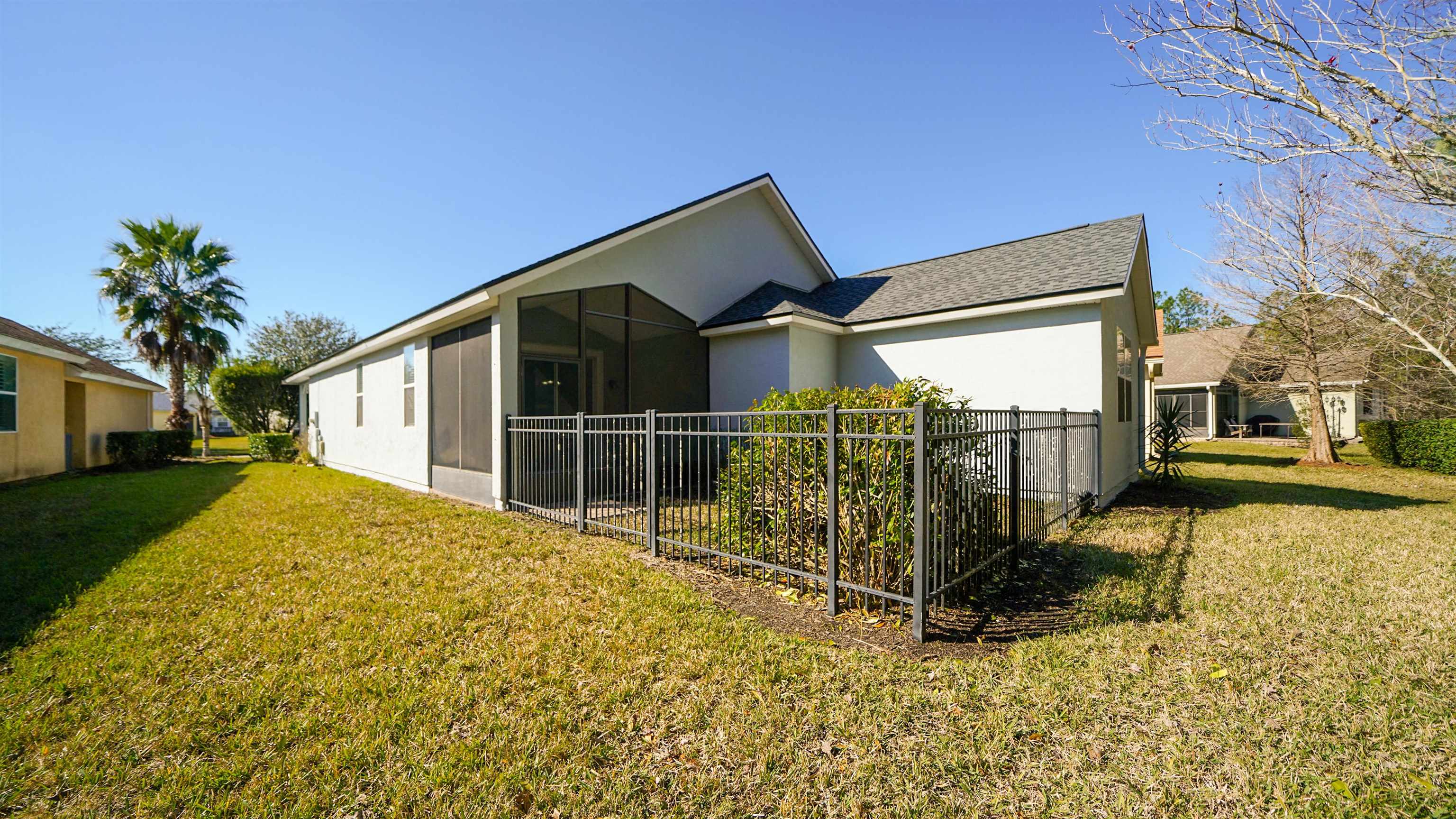 778 Copperhead Circle St. Augustine, FL 32092 - Photo 24 of 35 a view of a house with a wooden fence