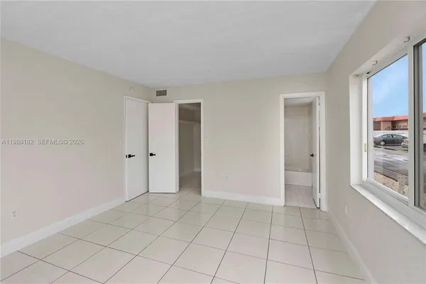 a view of an empty room and window