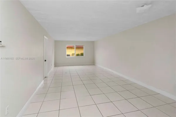 a view of an empty room and window
