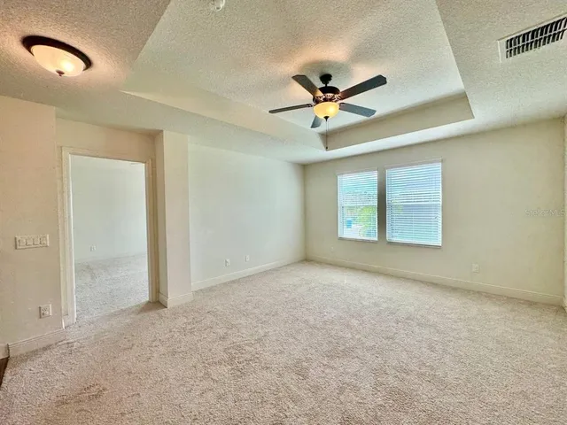 a view of a livingroom with a ceiling fan