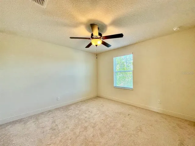 a bathroom with a toilet and a bathtub