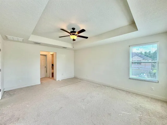a view of a bathroom from a hallway