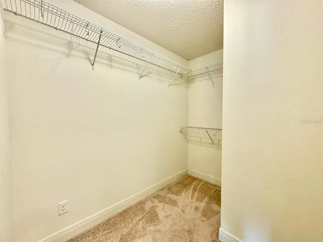 a large bathroom with a granite countertop sink and a mirror