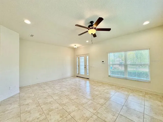 a kitchen with a sink a counter space appliances and cabinets