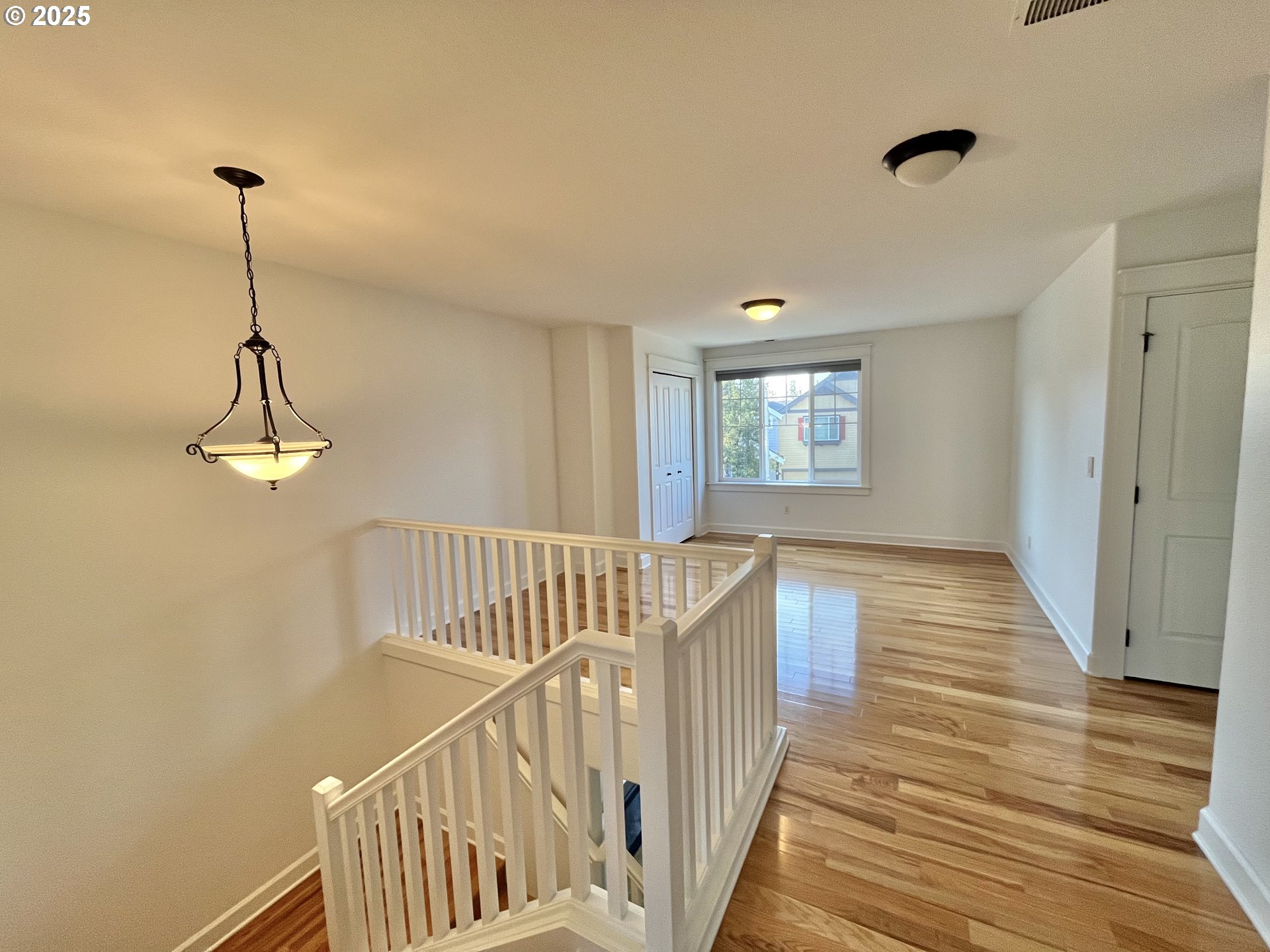 3535 Southeast 197th Avenue Camas, WA 98607 - Photo 14 of 24 a view of empty room with wooden floor and fan