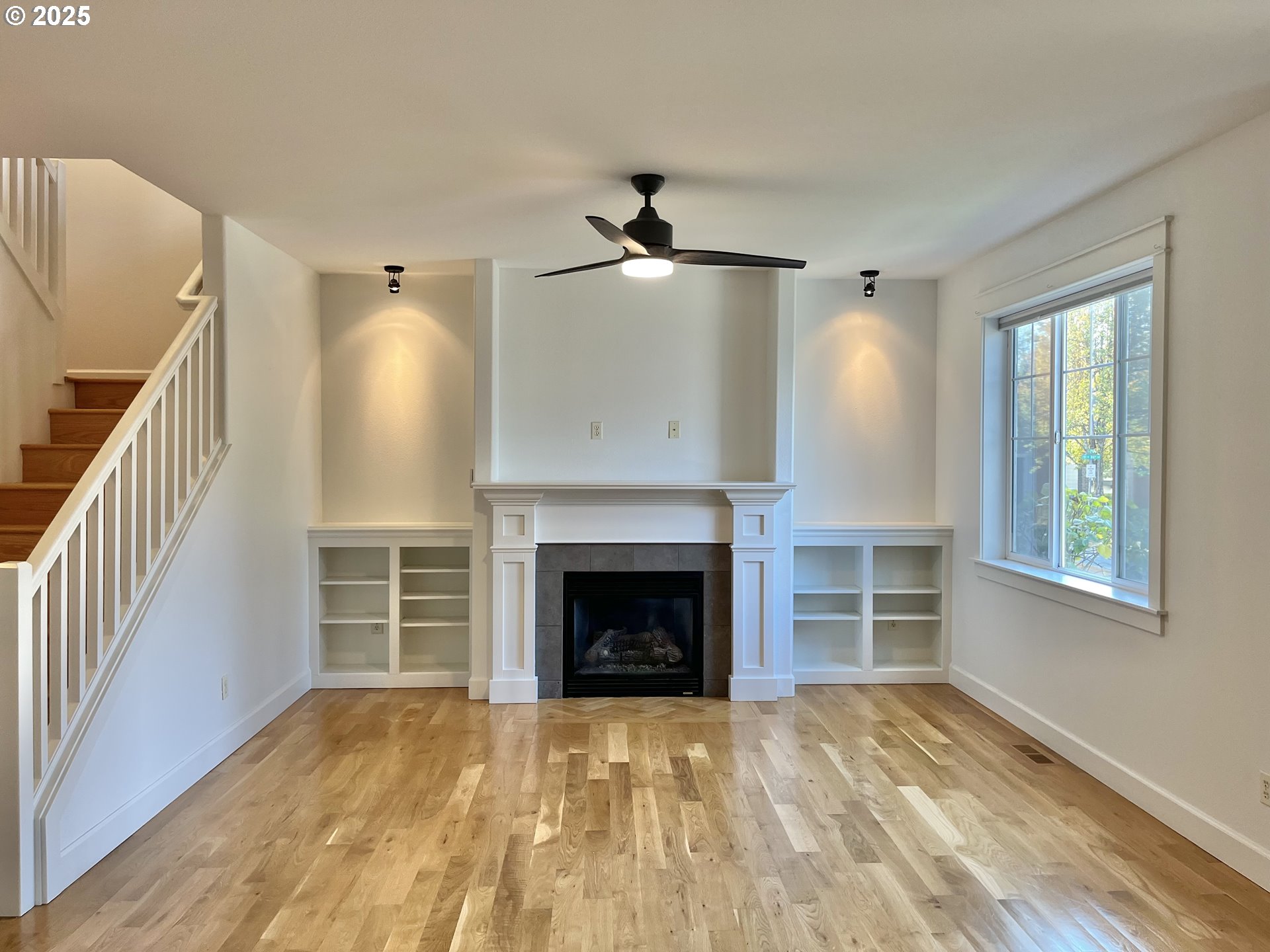 3535 Southeast 197th Avenue Camas, WA 98607 - Photo 9 of 24 a view of empty room with fireplace and wooden floor