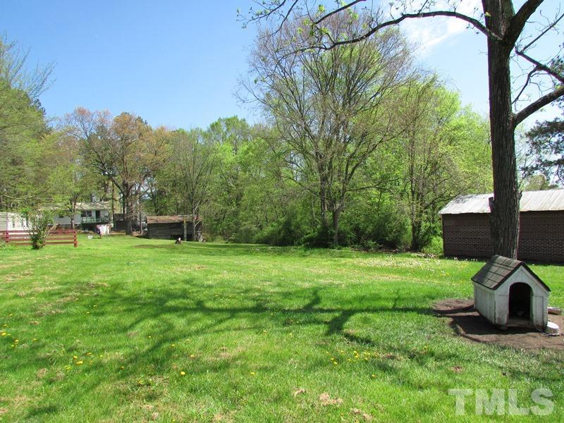 212 Cavel Chub Lake Road Roxboro, NC 27574 - Photo 13 of 18 Not a lot of grass to mow but enough back yard for your children, pets or small garden.