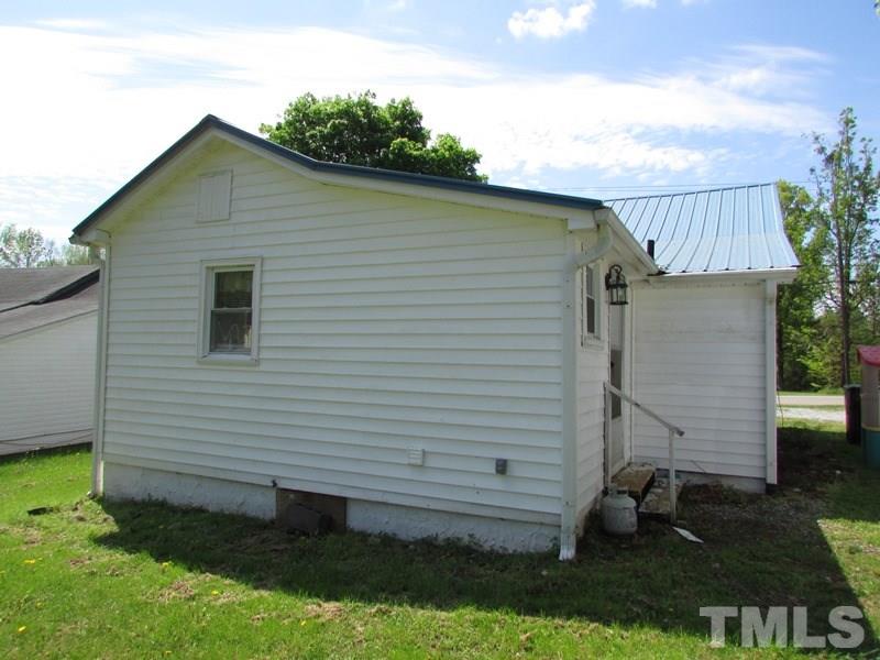 212 Cavel Chub Lake Road Roxboro, NC 27574 - Photo 14 of 18 Siding, metal roof, gutters, again a low maintenance home.