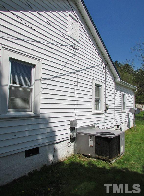 212 Cavel Chub Lake Road Roxboro, NC 27574 - Photo 15 of 18 From the side view you can see the heating/ac unit has been updated