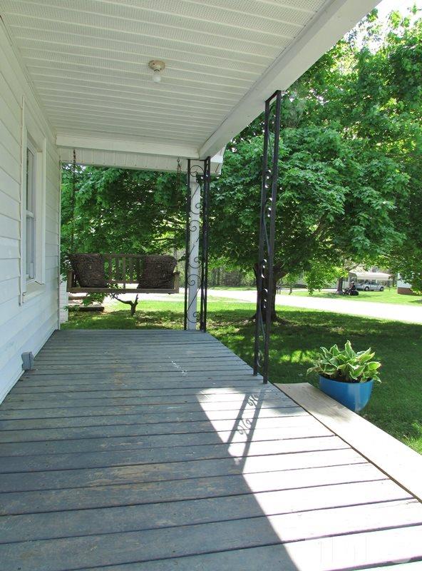 212 Cavel Chub Lake Road Roxboro, NC 27574 - Photo 3 of 18 There is room for rocking chairs, swing, and ferns.