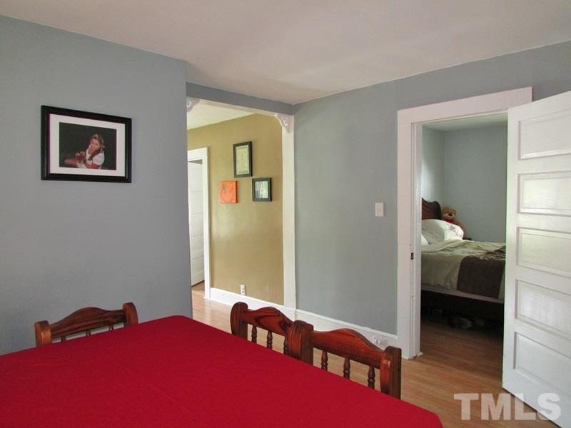 212 Cavel Chub Lake Road Roxboro, NC 27574 - Photo 7 of 18 Dining also has a large opening to the living area.