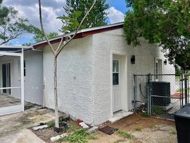 a backyard of a house with seating space