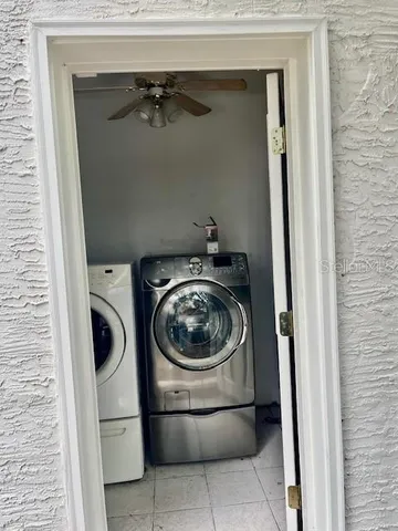 a utility room with dryer and washer