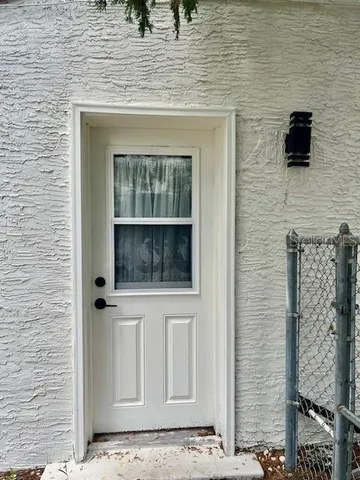 a view of a door and a window