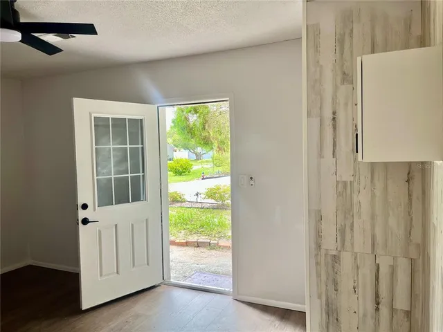 a view of an empty room with a window