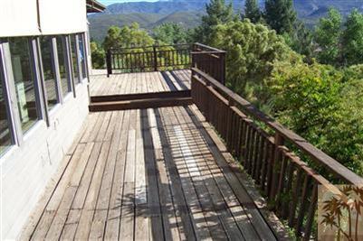 60533 Devils Ladder Road Mountain Center, CA 92561 - Photo 4 of 8 a view of balcony with wooden floor and fence