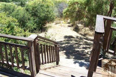 60533 Devils Ladder Road Mountain Center, CA 92561 - Photo 5 of 8 a view of a balcony with wooden floor