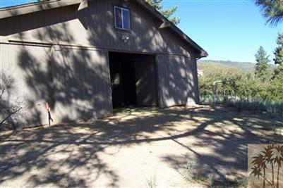 60533 Devils Ladder Road Mountain Center, CA 92561 - Photo 7 of 8 a view of a house with a yard
