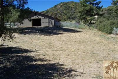 60533 Devils Ladder Road Mountain Center, CA 92561 - Photo 8 of 8 a view of a house with a yard