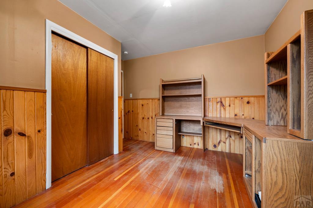 9600 Middle Creek Canyon Road Beulah, CO 81023 - Photo 22 of 50 a view of a hallway with furniture and wooden floor
