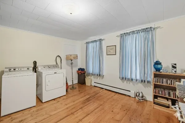 a view of a room with window and furniture