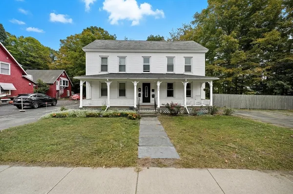 a front view of a house with a yard