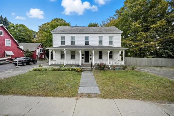front view of a house with a yard