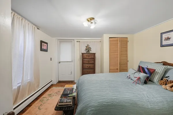 a bedroom with a bed and a walk in closet