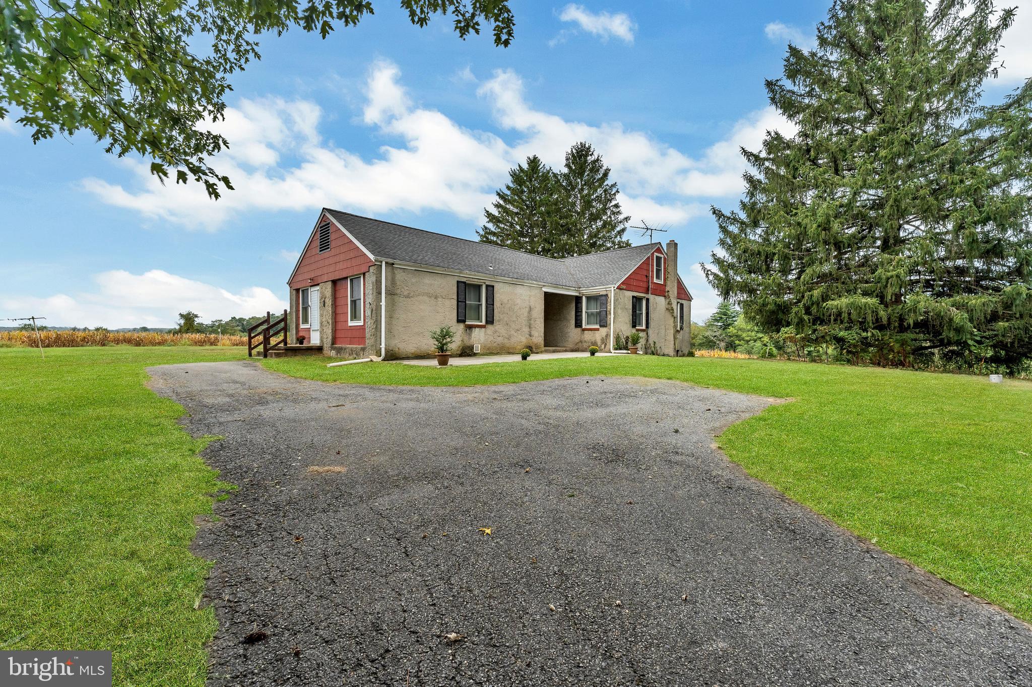 18225 Gunpowder Road Hampstead, MD 21074 - Photo 21 of 30 a front view of a house with a yard and trees