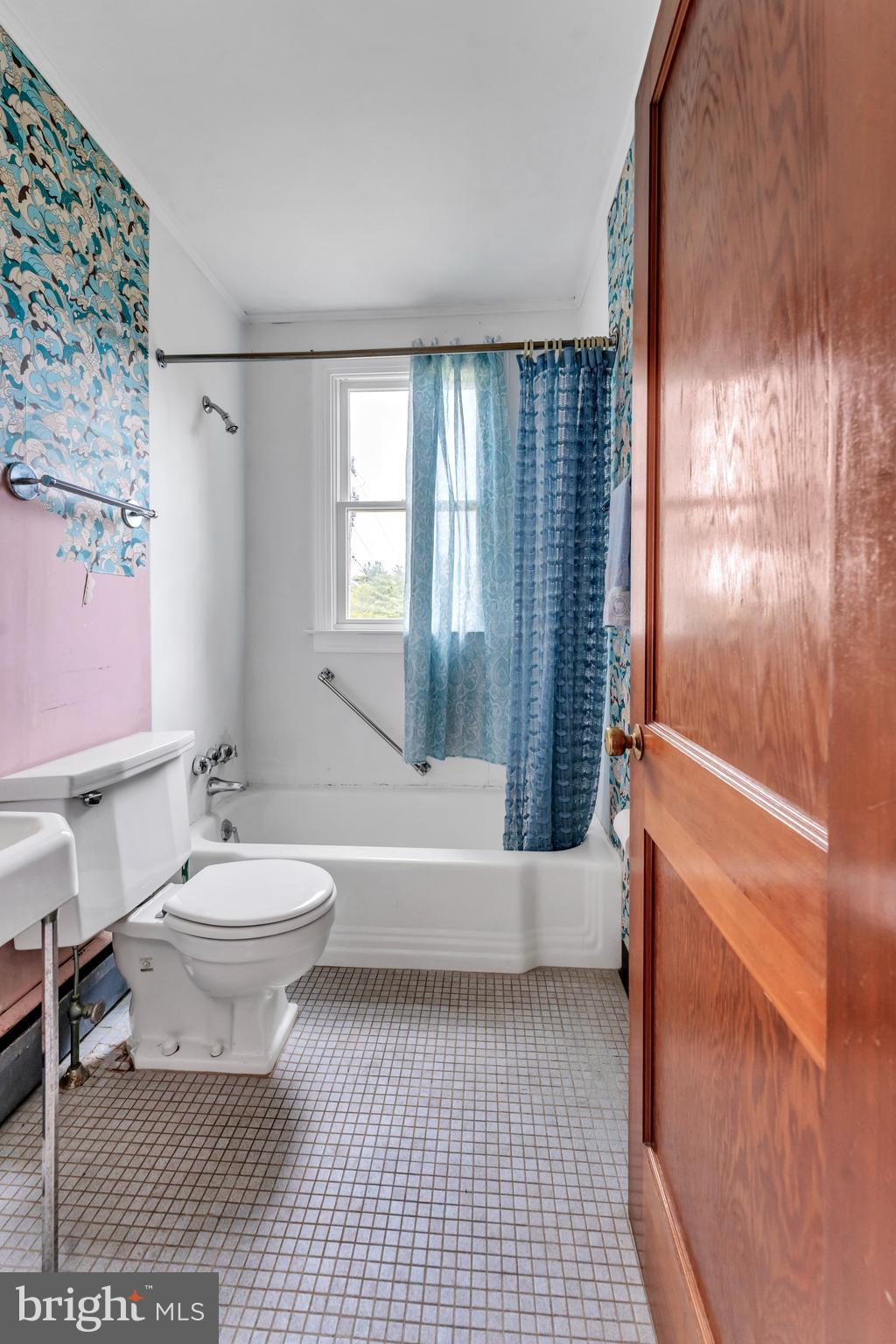 18225 Gunpowder Road Hampstead, MD 21074 - Photo 23 of 30 a bathroom with a toilet a bath tub and a shower