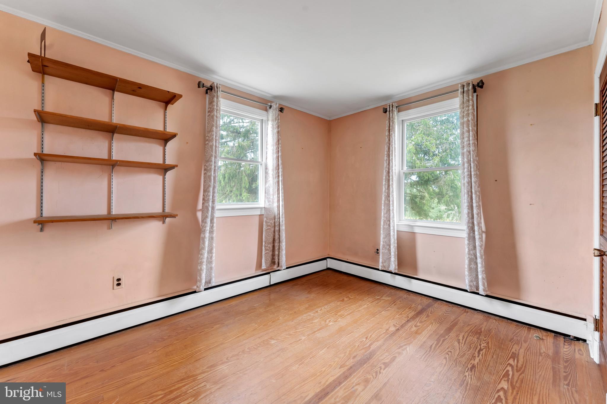 18225 Gunpowder Road Hampstead, MD 21074 - Photo 24 of 30 an empty room with wooden floor and windows