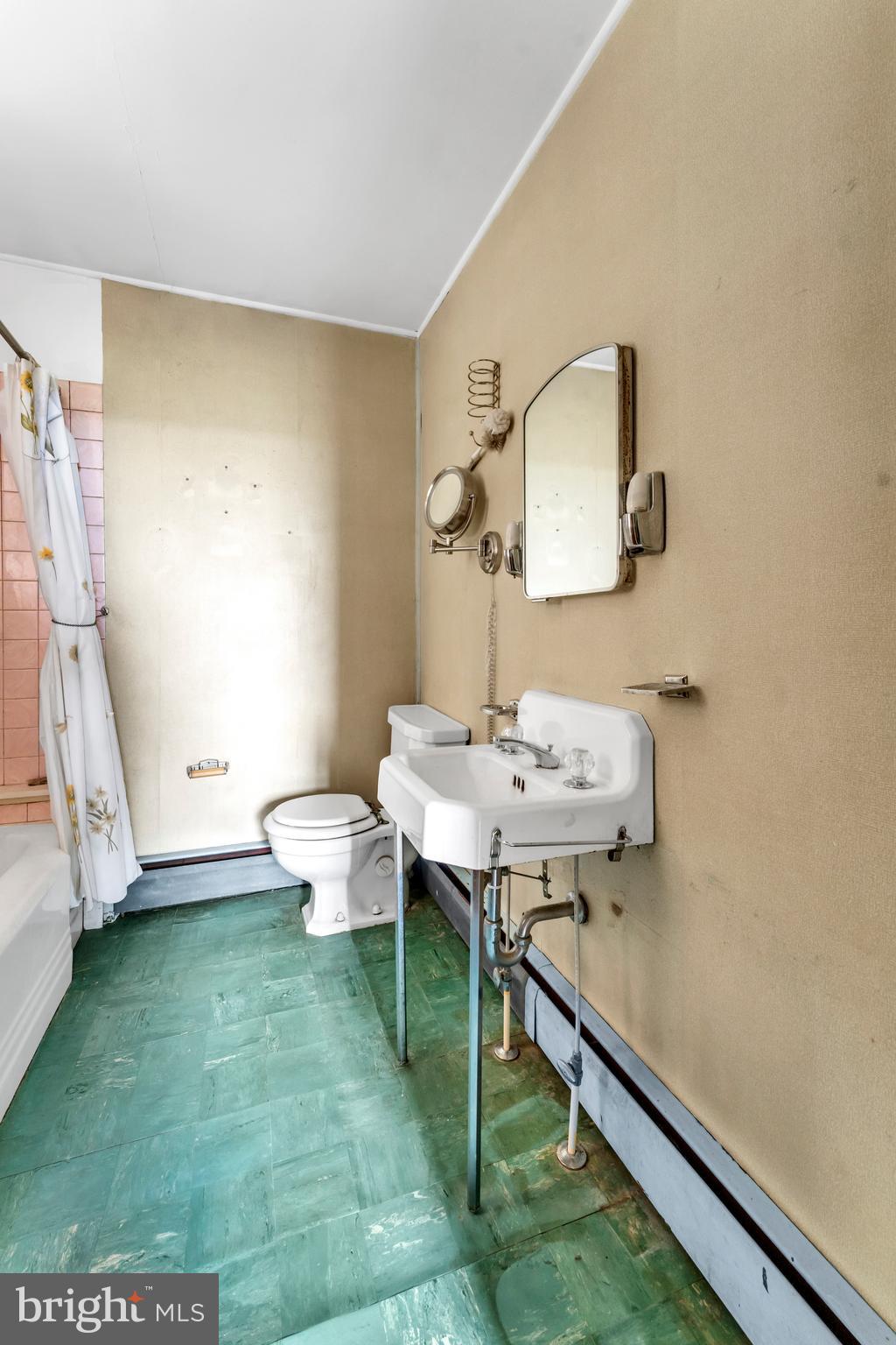 18225 Gunpowder Road Hampstead, MD 21074 - Photo 27 of 30 a bathroom with a sink mirror and toilet