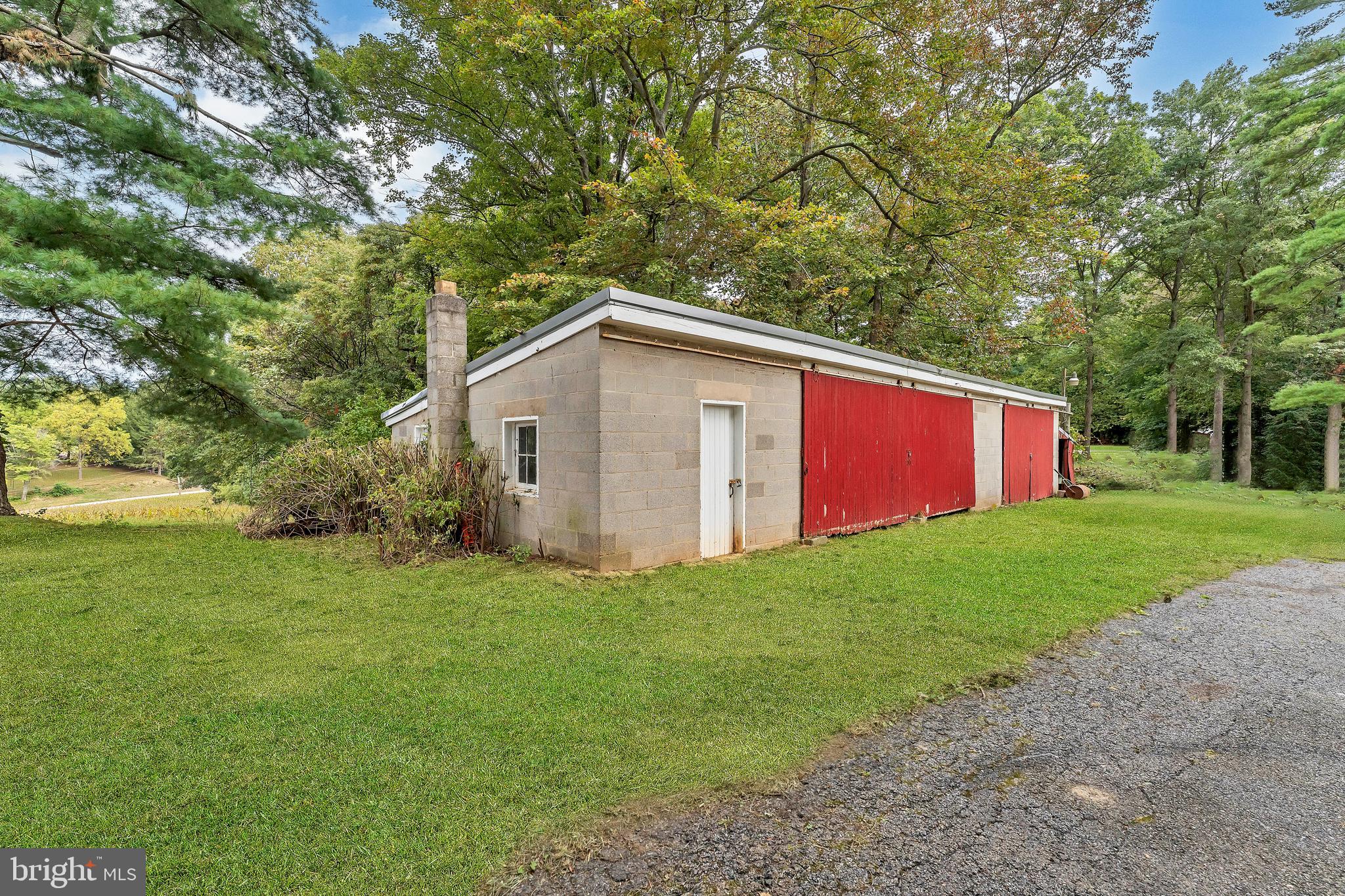 18225 Gunpowder Road Hampstead, MD 21074 - Photo 28 of 30 a view of a backyard with large trees