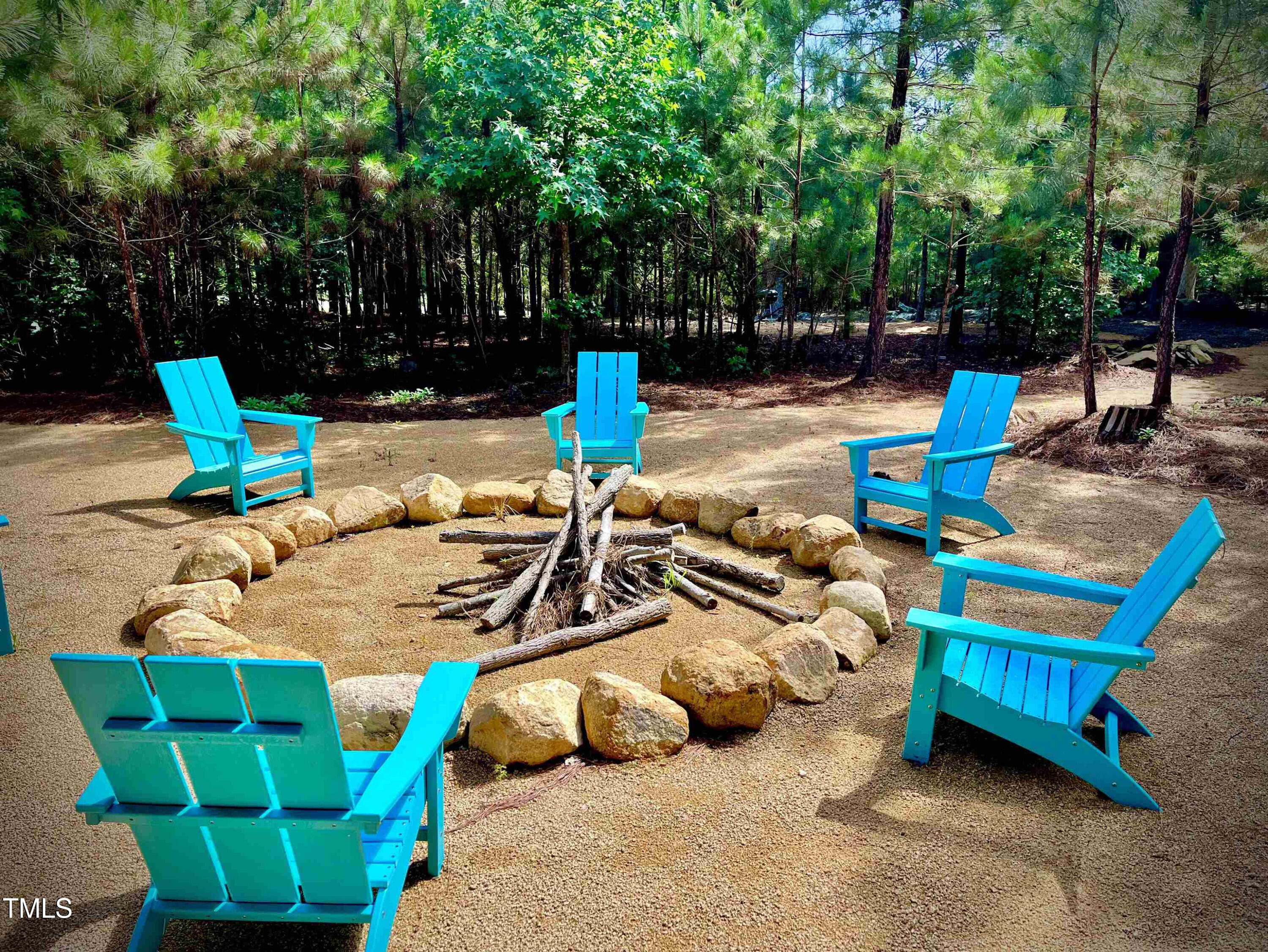 586 Poythress Road Chapel Hill, NC 27516 - Photo 11 of 33 a view of backyard with swimming pool and seating space