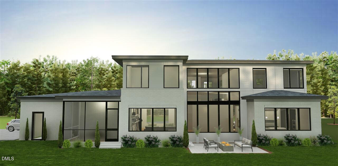 586 Poythress Road Chapel Hill, NC 27516 - Photo 2 of 33 a front view of a house with a yard and porch