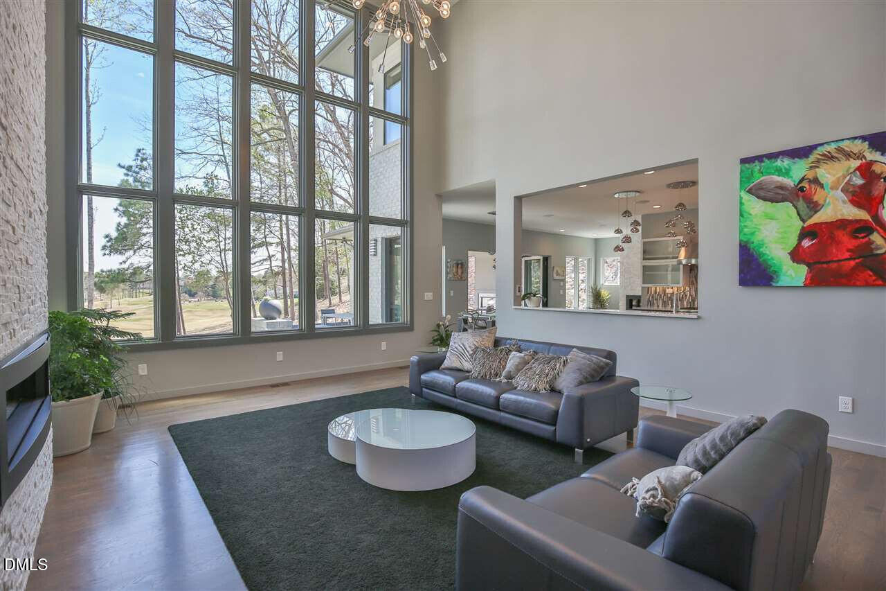 586 Poythress Road Chapel Hill, NC 27516 - Photo 5 of 33 a living room with furniture and a large window