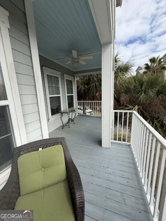 a balcony with furniture and a garden