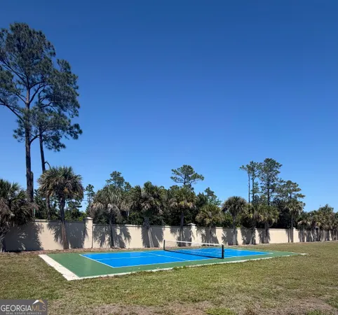a house view with swimming pool in front of it