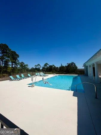 a swimming pool view with a outdoor space