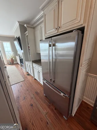 a view of kitchen with wooden floor